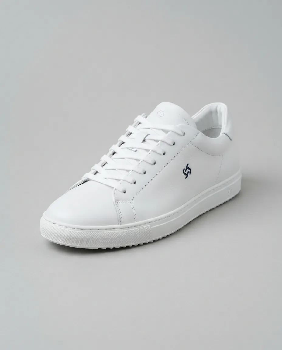 White leather sneaker with a small logo on its side panel, seen from the front and slightly from the side on a plain light grey background, the single input image