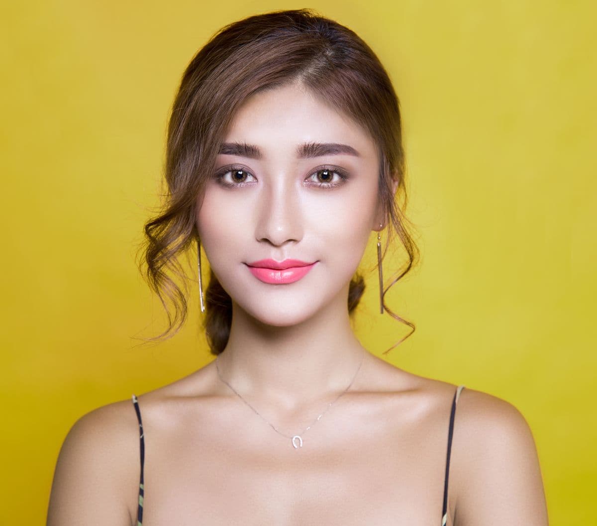 Clean studio headshot of a woman with a soft background